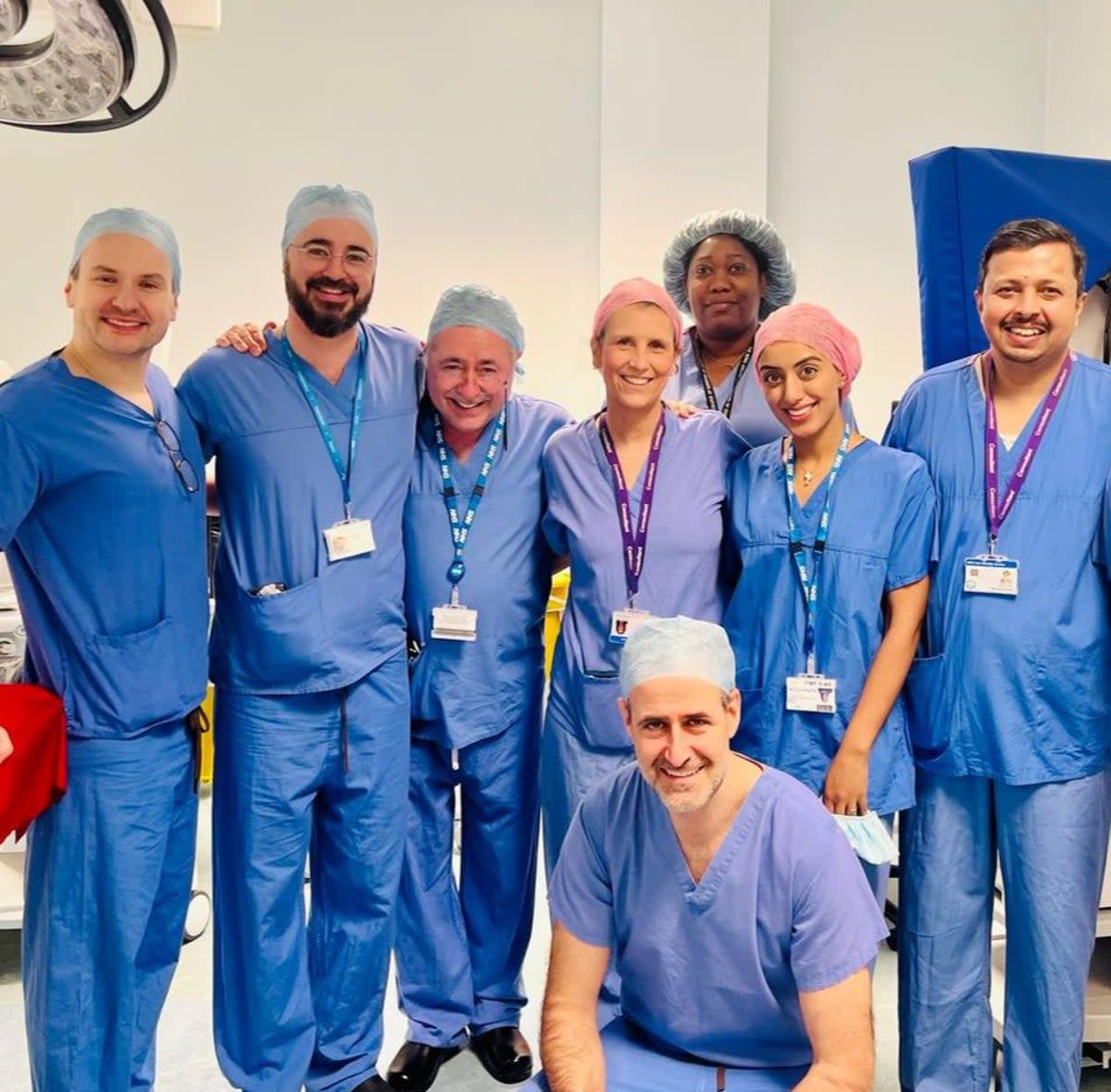 The lead surgeons for Britain’s first womb transplant, including Professor Richard Smith (centre left) and consultant surgeon Isabel Quiroga (centre right) (Womb Transplant UK (supplied))