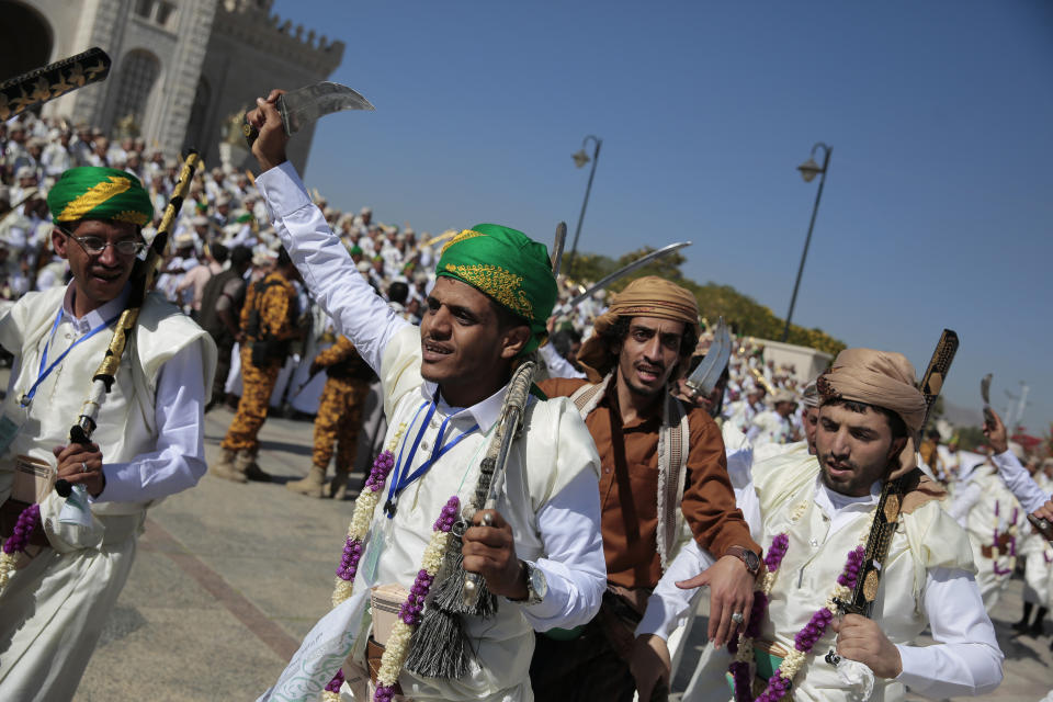FILE - Thousands of Yemeni grooms dressed in traditional attire participate in a mass wedding, held by the Houthis for thousands of couples in Sanaa, Yemen, Thursday, Dec. 02, 2021. Iran and Saudi Arabia have agreed to reestablish diplomatic relations and reopen embassies after years of tensions. The two countries released a joint communique about the deal on Friday, March 10, 2023 with China, which apparently brokered the agreement. (AP Photo/Hani Mohammed, File)