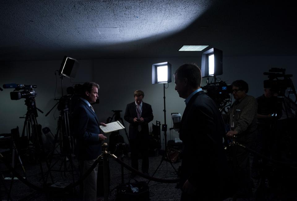 People wait for the hearing