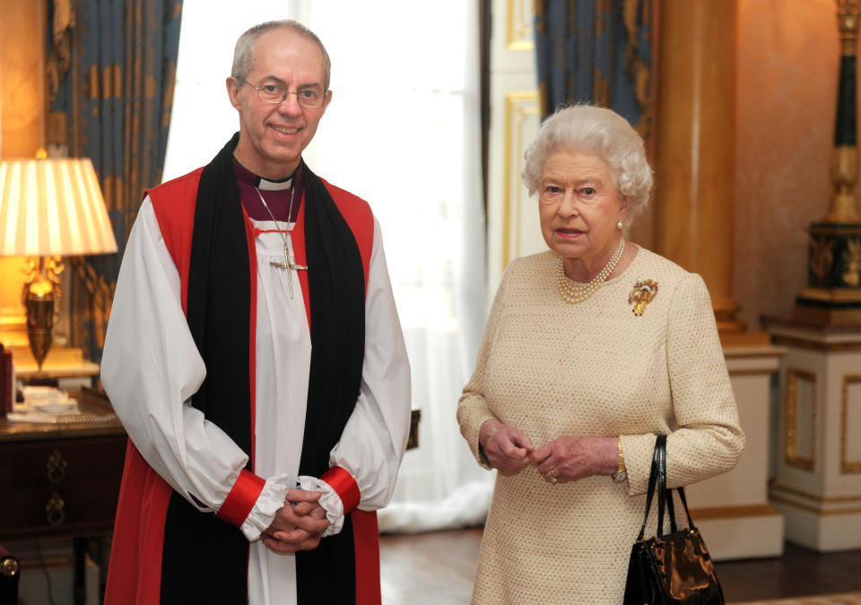 Britain's Queen Elizabeth II (R) receives new Archbishop of Canterbury Justin Welby (L) at Buckingham Palace in central London on February 26, 2013 after his act of 'Homage' to the Queen, one of the formal stages of his appointment before he begins his public ministry. The new Archbishop of Canterbury Justin Welby, a former oil executive who has risen swiftly up the ranks of the Church of England, will be enthroned at Canterbury on March 21. AFP PHOTO / POOL / ANTHONY DEVLIN        (Photo credit should read Anthony Devlin/AFP via Getty Images)