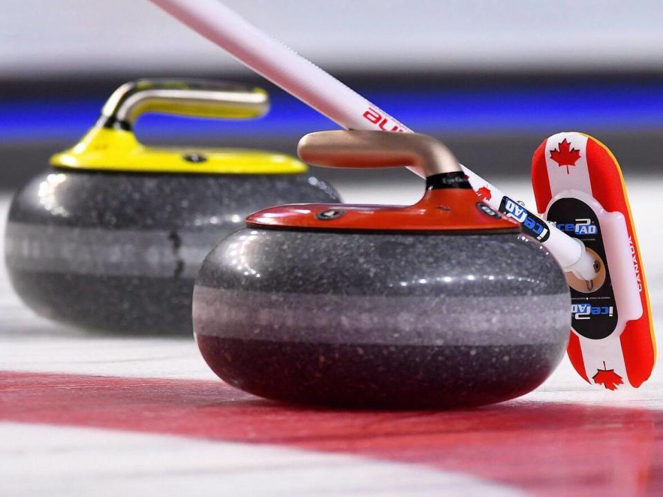 The province has increased the amount of a grant for curling clubs and rinks so they can keep operating through times of COVID-19 restrictions. (Sean Kilpatrick/The Canadian Press - image credit)