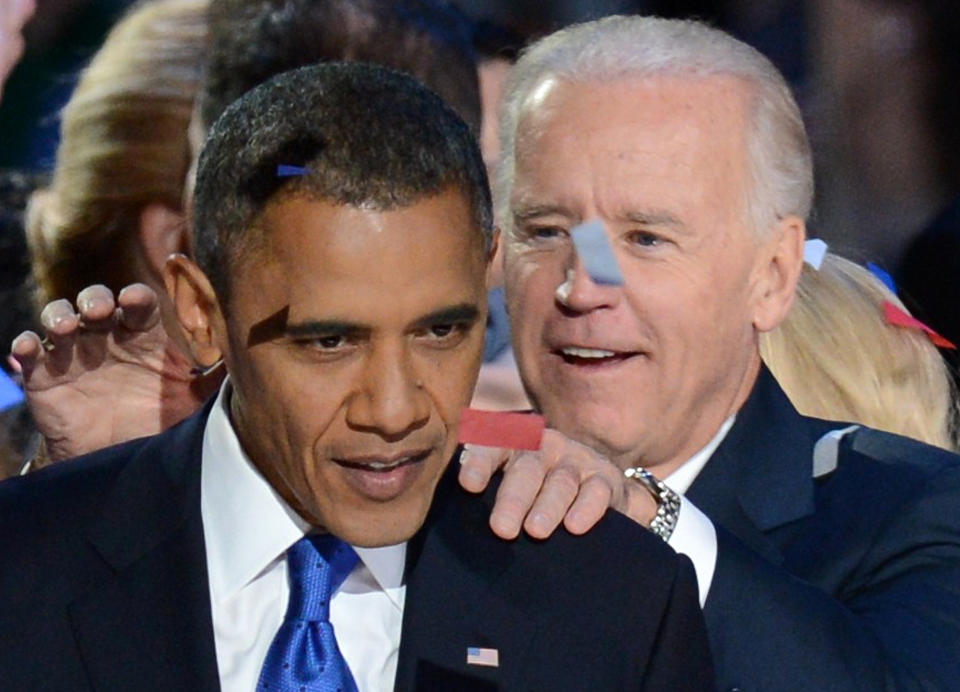 US President Barack Obama and Vice President Joe Biden celebrate winning the 2012 US presidential election November 7, 2012 in Chicago, Illinois.  Obama swept to re-election, forging history again by defying the dragging economic recovery and high unemployment which haunted his first term to beat Republican Mitt Romney.   AFP PHOTO / Saul LOEB        (Photo credit should read SAUL LOEB/AFP/Getty Images)