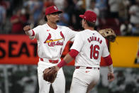 St. Louis Cardinals' Masyn Winn, left, and Nolan Gorman (16) celebrate a 3-0 victory over the Philadelphia Phillies in a baseball game Tuesday, April 9, 2024, in St. Louis. (AP Photo/Jeff Roberson)