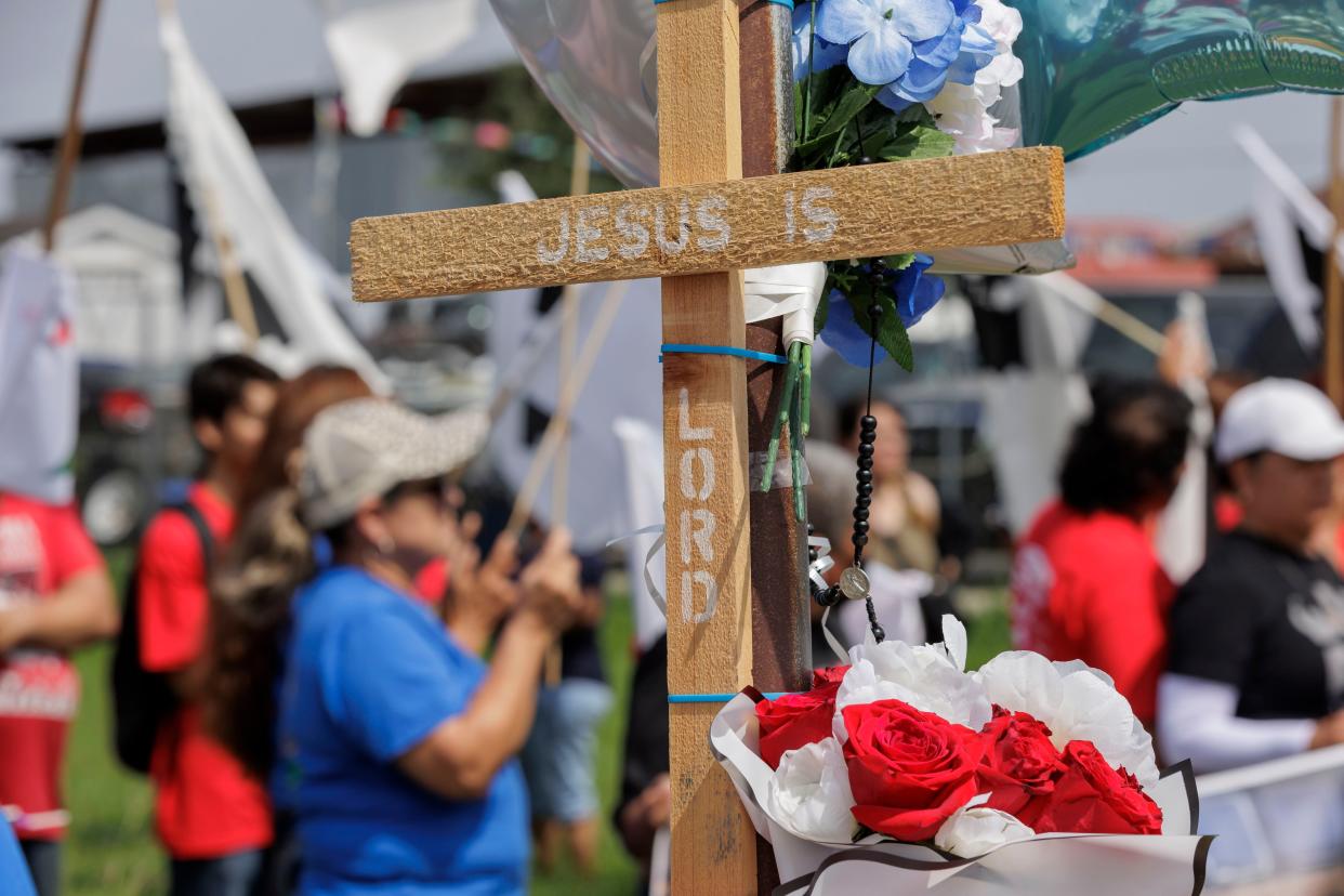 A cross setup at a memorial at a vigil for 8 migrants that were run over and killed yesterday waiting at a bus stop on 8 May 2023 in Brownsville, Texas (Getty Images)
