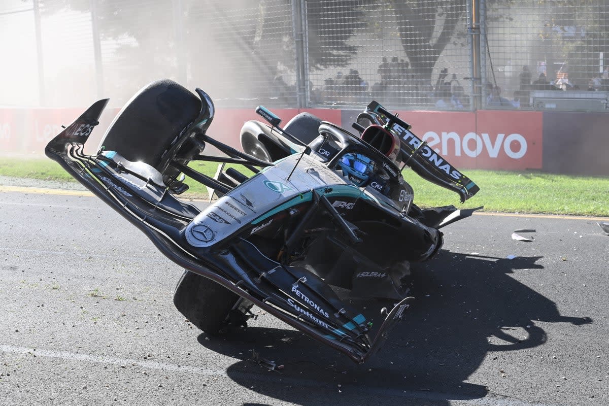 Russell's Mercedes ended up on his side after he rebounded off the wall on the penultimate lap (AFP via Getty Images)