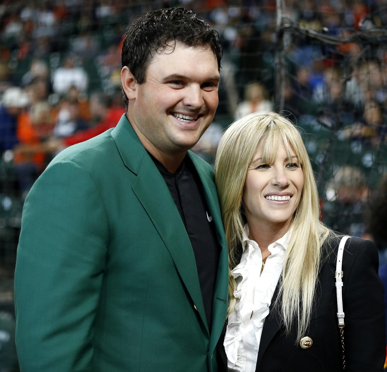 Patrick Reed, 2018 Masters champion and wife Justine after receiving a Houston Astros jersey from owner Jim Crane at Minute Maid Park