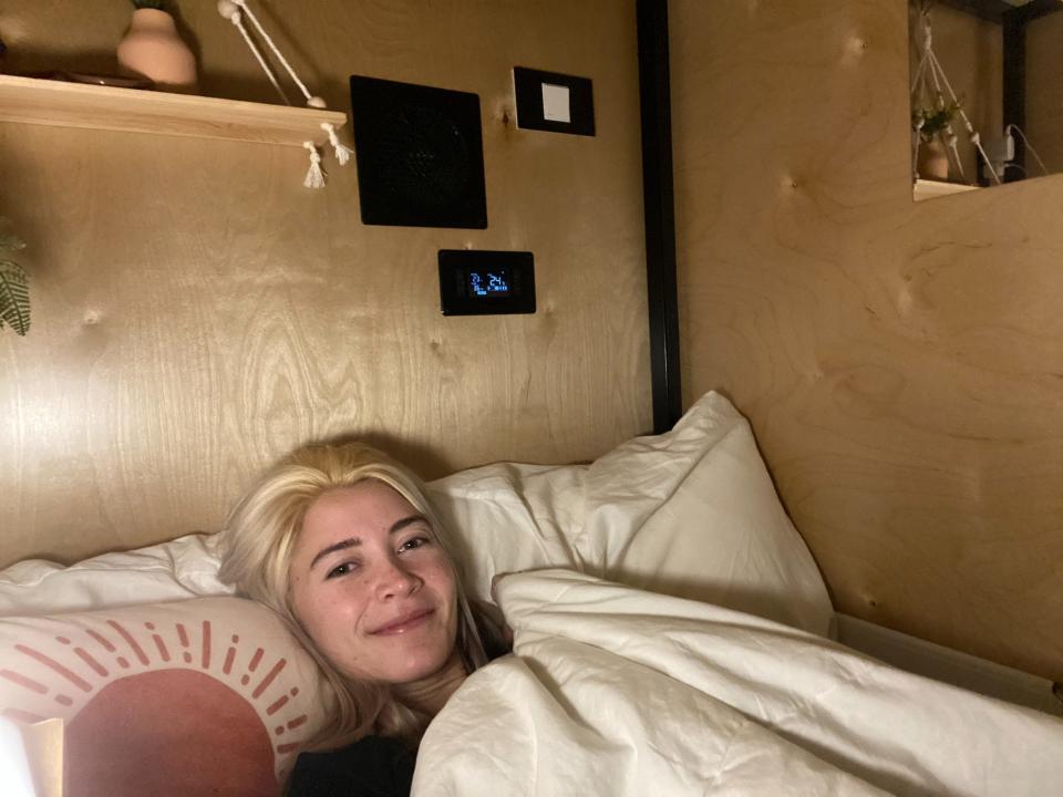 Christina Lennox inside a compact sleep pod in co-living house