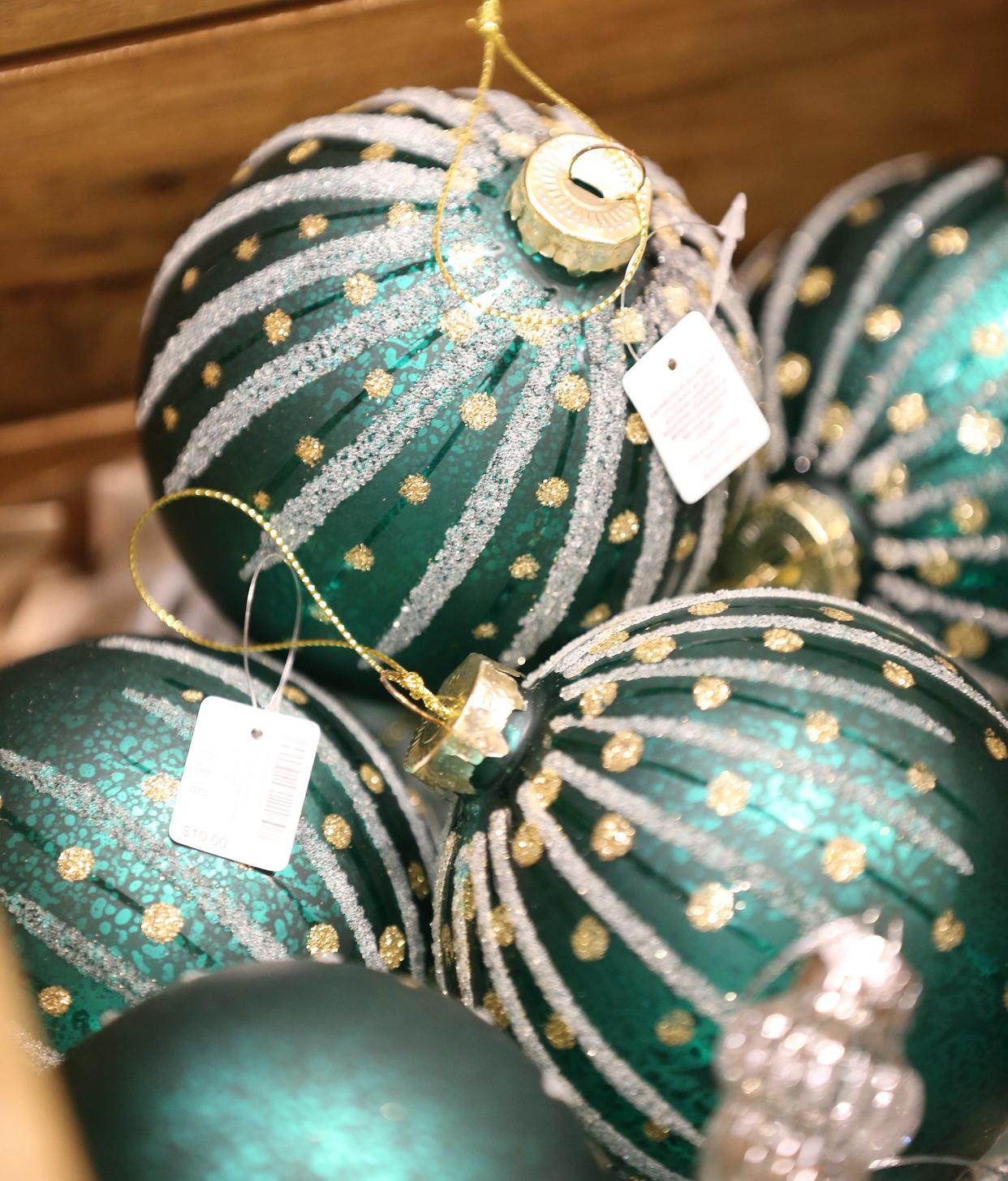 Emerald green and gold is a trending color combination for holiday decorating in 2022. Dillard's Home Store Mall St. Matthews