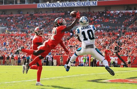 De'Vante Harris #22 of the Tampa Bay Buccaneers breaks up a pass intended for Curtis Samuel #10 of the Carolina Panthers during the second quarter at Raymond James Stadium - Credit: Mike Ehrmann/Getty Images