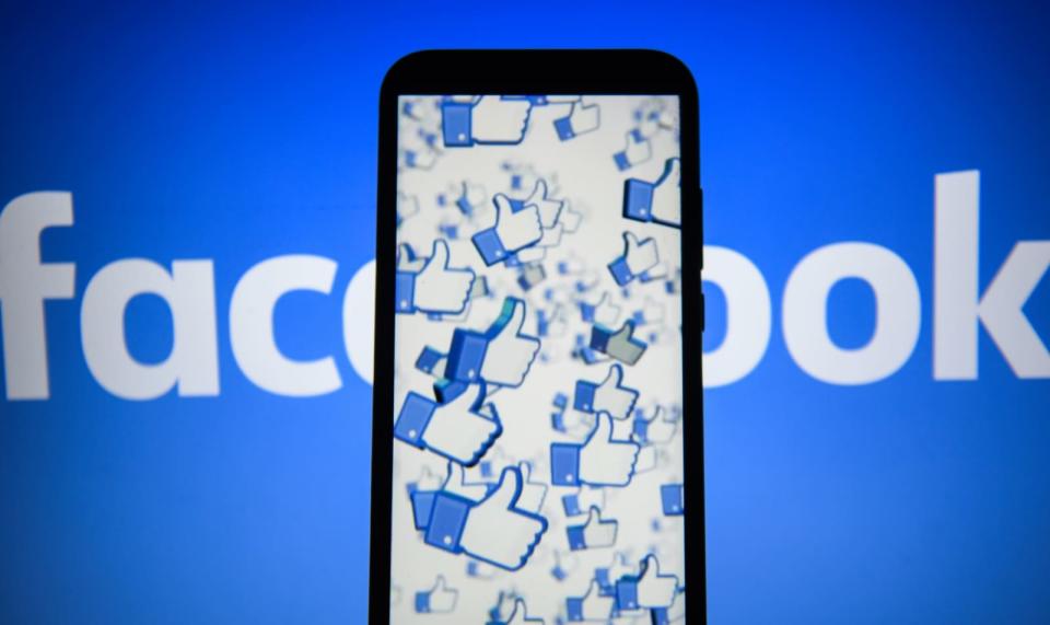 Facebook likes logo are seen on an android mobile phone