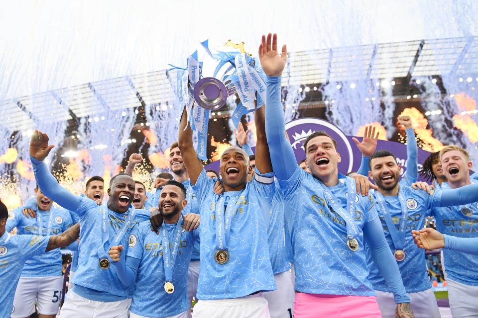 Fernandinho of Manchester City lifts the Premier League Trophy (Getty)