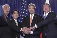 (L-R) Japanese Defense Minister Nakatani, Japanese Foreign Minister Kishida, US Secretary of State John Kerry and Secretary of Defense Ashton Carter pose for a picture after a meeting on April 27, 2015 in New York