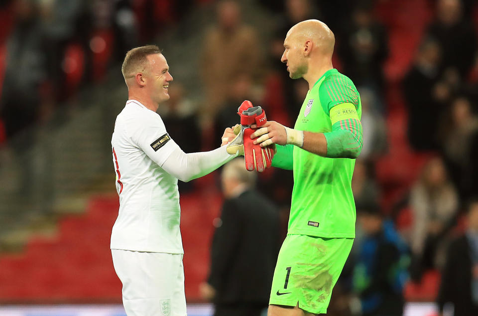 Wayne Rooney and Brad Guzan after the game.