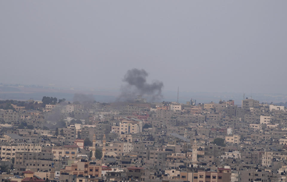 Smoke rises following Israeli airstrikes on a building in Gaza City, Friday, Aug. 5, 2022. Palestinian officials say Israeli airstrikes on Gaza have killed several people, including a senior militant, and wounded 40 others. (AP Photo/Hatem Moussa)