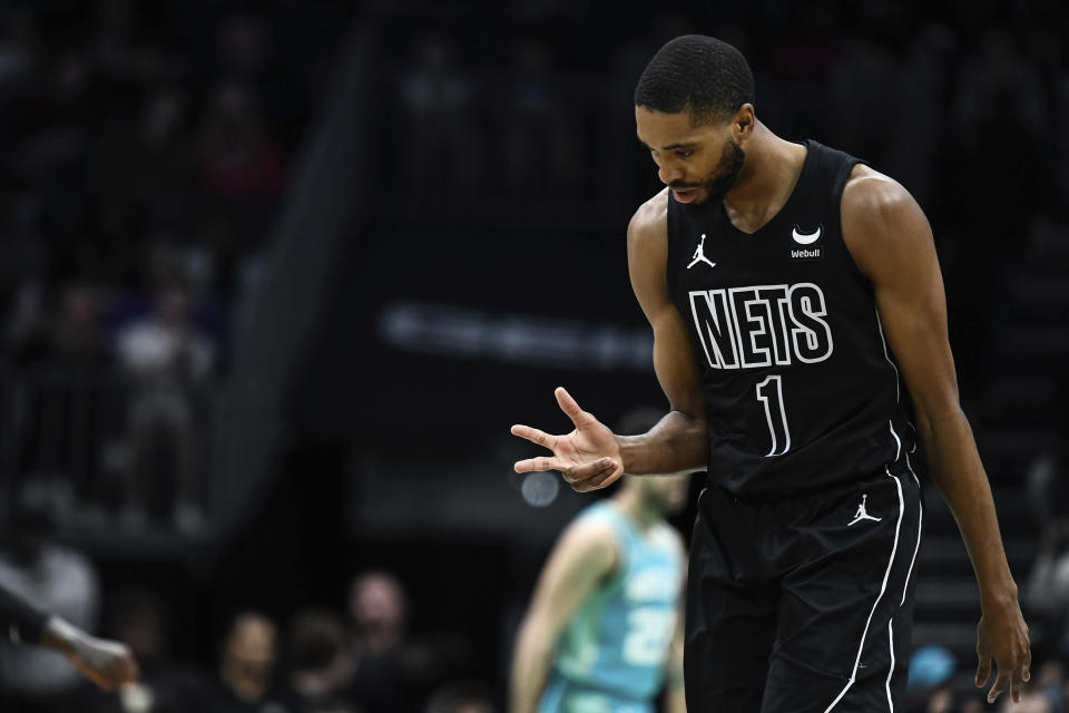 Brooklyn Nets forward Mikal Bridges (1) gestures after making a three point basket during the first half of an NBA basketball game against the Charlotte Hornets, Saturday, March 9, 2024, in Charlotte, N.C. (AP Photo/Matt Kelley)