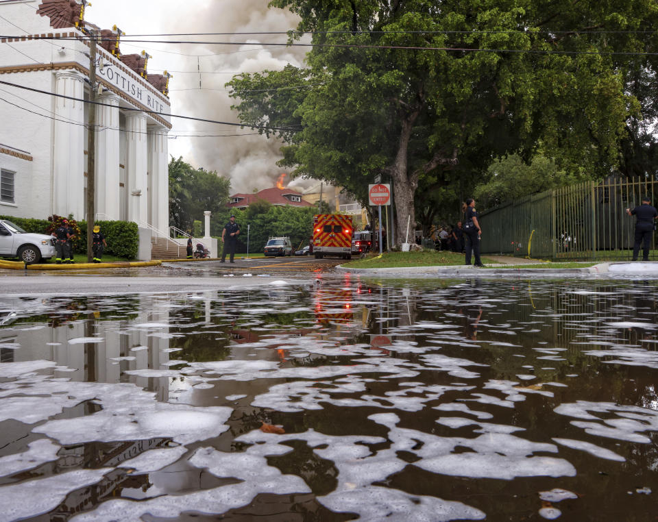 Miami Fire Rescue and Miami police work at the scene of the fire at the Temple Court Apartments, Monday, June 10, 2024 in Miami. (Carl Juste/Miami Herald via AP)