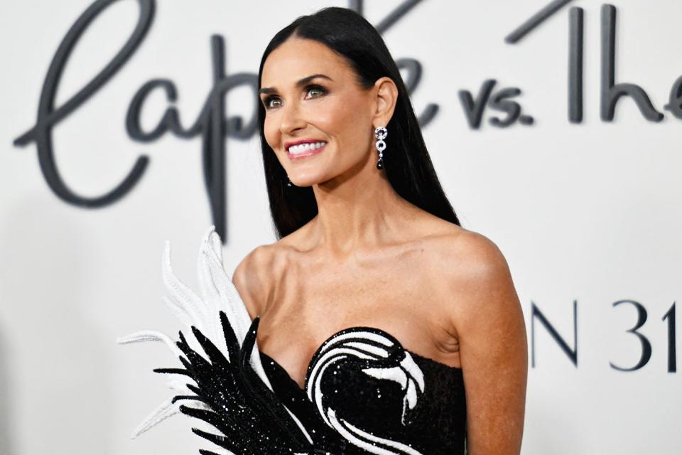 <p>ANGELA WEISS/AFP via Getty </p> Demi Moore on Jan. 23, 2024