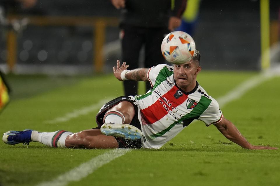 Jonathan Benitez of Chile's Palestino keeps the ball in play during a Copa Libertadores Group E soccer match against Colombia's Millonarios at El Campin stadium in Bogota, Colombia, May 14, 2024. (AP Photo/Fernando Vergara)