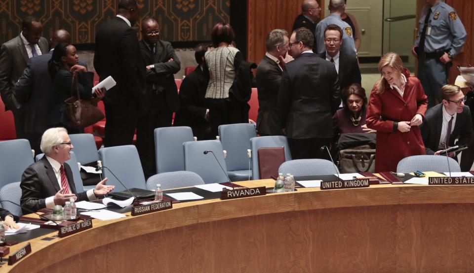 U.N. Russian Ambassador Vitaly Churkin, left, and U.S. Ambassador to the U.N. Samantha Power, second from right, acknowledge each other as they arrive for a U.N. Security Council meeting on the Ukraine, Wednesday March 19, 2014, at United Nations Headquarters. (AP Photo/Bebeto Matthews)