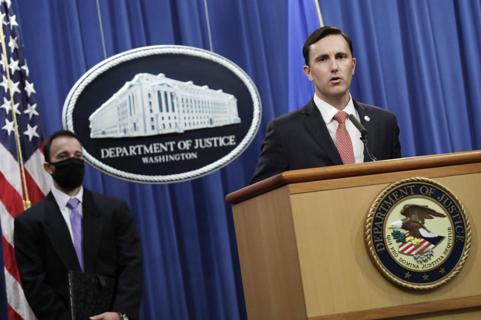 Acting Assistant Attorney General Brian Rabbitt, of the Justice Department's Criminal Division and other officials, speak, Thursday, Oct. 22, 2020, at the Justice Department in Washington. A subsidiary of Goldman Sachs pleaded guilty on Thursday and agreed to pay more than $2 billion in a foreign corruption probe tied to the Malaysian 1MDB sovereign wealth fund, which was looted of billions of dollars in a corruption scandal. The company, Goldman Sachs Malaysia, entered the plea in federal court in Brooklyn. (Yuri Gripas/The New York Times via AP, Pool)