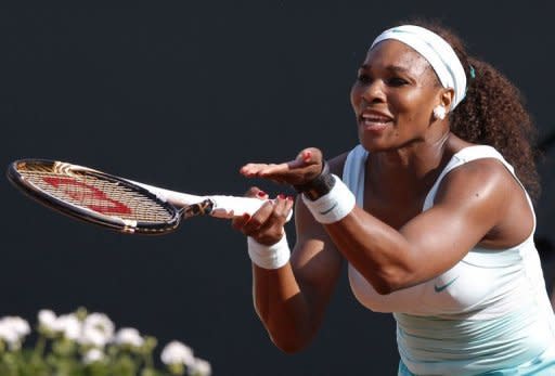 American Serena Williams protests a call during a match with France's Virginie Razzano at the French Open in Paris. Williams bowed out in a three-set shocker to 111th-ranked home hope Razzano in the pair's first meeting which the Frenchwoman clinched 4-6, 7-6 (7/5), 6-3 in 3hr 03min