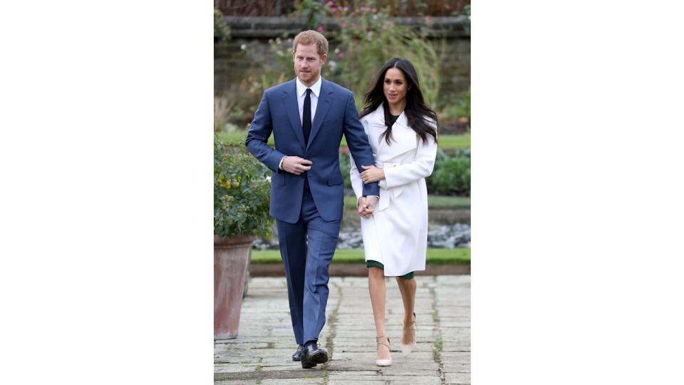   Prince Harry and actress Meghan Markle during an official photocall to announce their engagement at The Sunken Gardens at Kensington Palace on November 27, 2017 in London, England.  