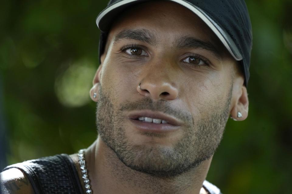 Olympic champion Marcell Jacobs talks during an interview with the Associated Press in Rome, Monday, May 23, 2022. This year could be more memorable for Jacobs than his breakout 2021 when he sprinted from virtual unknown to Olympic 100-meter champion then added another surprising gold at the Tokyo Games with Italy's 4x100-meter relay team. Jacobs tells The Associated Press that "winning these next two big events would mean winning everything there is to win in athletics.".(AP Photo/Alessandra Tarantino)