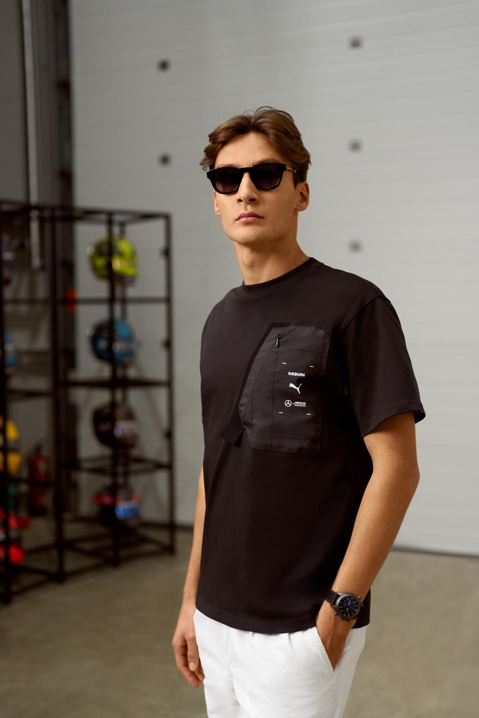 George Russell wearing a look from the Mercedes-AMG Petronas F1 Team x Puma x Raeburn collection