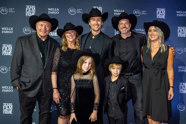 <p>Chris Saucedo/Getty</p> Glen Powell poses with his family in Austin, Texas on May 16, 2024