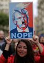 <p>A woman holds a cartoon depicting Donald Trump during the Women’s March rally in Barcelona, Spain, Saturday, Jan. 21, 2017. The march was held in solidarity with the Women’s March on Washington, advocating women’s rights and opposing Donald Trump’s presidency. (AP Photo/Manu Fernandez) </p>