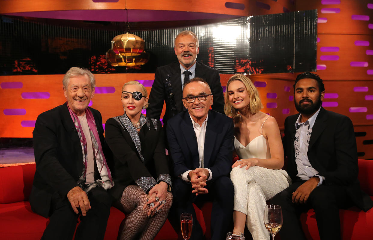 Host Graham Norton with (seated left to right) Sir Ian McKellen, Madonna, Danny Boyle, Lily James, and Himesh Patel during the filming for the Graham Norton Show at BBC Studioworks 6 Television Centre, Wood Lane, London, to be aired on BBC One on Friday evening. (Photo by Isabel Infantes/PA Images via Getty Images)