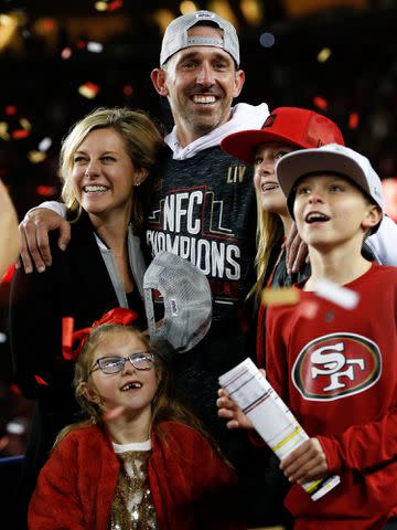 <p>Michael Zagaris/San Francisco 49ers/Getty</p> Kyle Shanahan and Mandy Shanahan with their kids Stella, Carter, and Lexi.