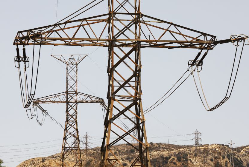 LOS ANGELES, CA - JULY 12: DC Power lines in the North San Fernando Valley near the Sylmar Converter Station, a piece of power grid infrastructure operated by LADWP threatened by Oregon wildfires that almost caused the lights to go out in California on Friday night. The Sylmar Converter Station is the terminus of the Pacific DC Intertie, a giant power line that runs from the Columbia River to Southern California and one of two lines that was affected by the wildfire. The Pacific DC Intertie capacity is enough to serve two to three million Los Angeles households and represents almost half of the Los Angeles Department of Water and Power (LADWP) electrical system's peak capacity. Sylmar on Monday, July 12, 2021 in Los Angeles, CA. (Al Seib / Los Angeles Times).