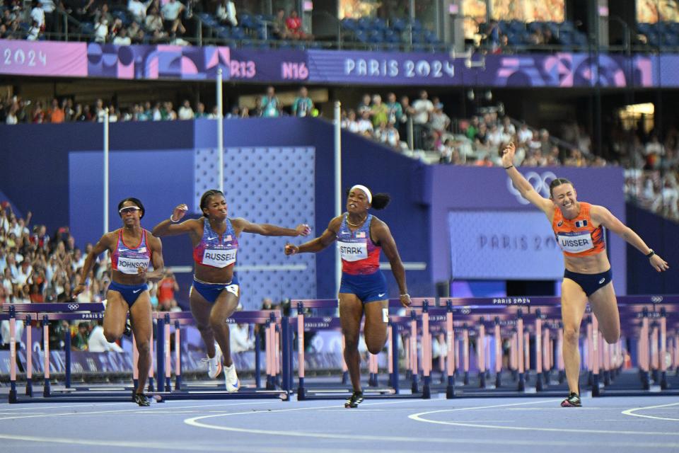 7 photos of Masai Russell's photo finish to win Olympic women's 100m