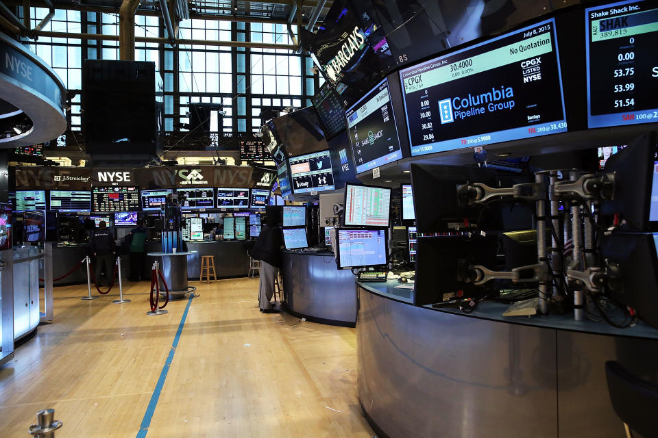 NEW YORK, NY - JULY 08:  Traders wait on a nearly empty trading floor at the New York Stock Exchange (NYSE) after trading was halted due to a "technical glitch" on July 8, 2015 in New York City. Trading was to resume in the afternoon.  (Photo by Spencer Platt/Getty Images)