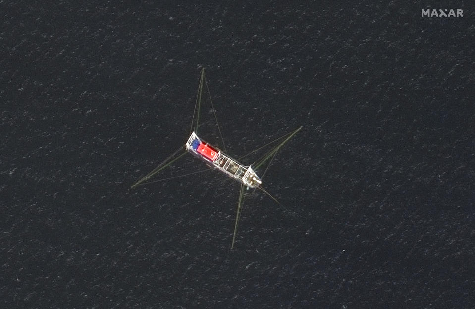 This satellite image provided by Maxar Technologies shows a Chinese fishing vessel in the Whitsun Reef located in the disputed South China Sea. Tuesday, March 23, 2021. The United States said Tuesday it’s backing the Philippines in a new standoff with Beijing in the disputed South China Sea, where Manila has asked a Chinese fishing flotilla to leave a reef. China ignored the call, insisting it owns the offshore territory. (©2021 Maxar Technologies via AP)