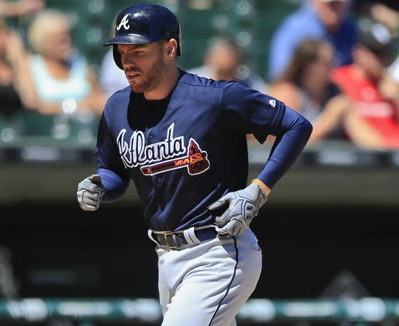 Freddie Freeman runs the bases after hitting a solo home run against the White Sox. (AP)