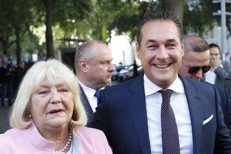 Top candidate and head of far-right Freedom Party (FPOe) Heinz-Christian Strache and his mother Marion Strache arrive at a polling station in Vienna, Austria October 15, 2017. REUTERS/Leonhard Foeger