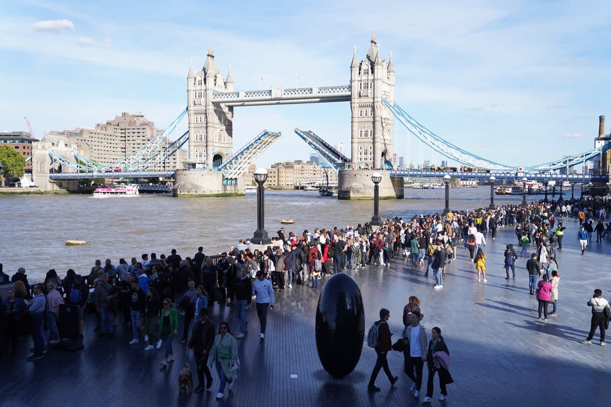 Members of the public in the queued near Tower Bridge in London as they waited to view Queen Elizabeth II lying in state (James Manning/PA) (PA Wire)