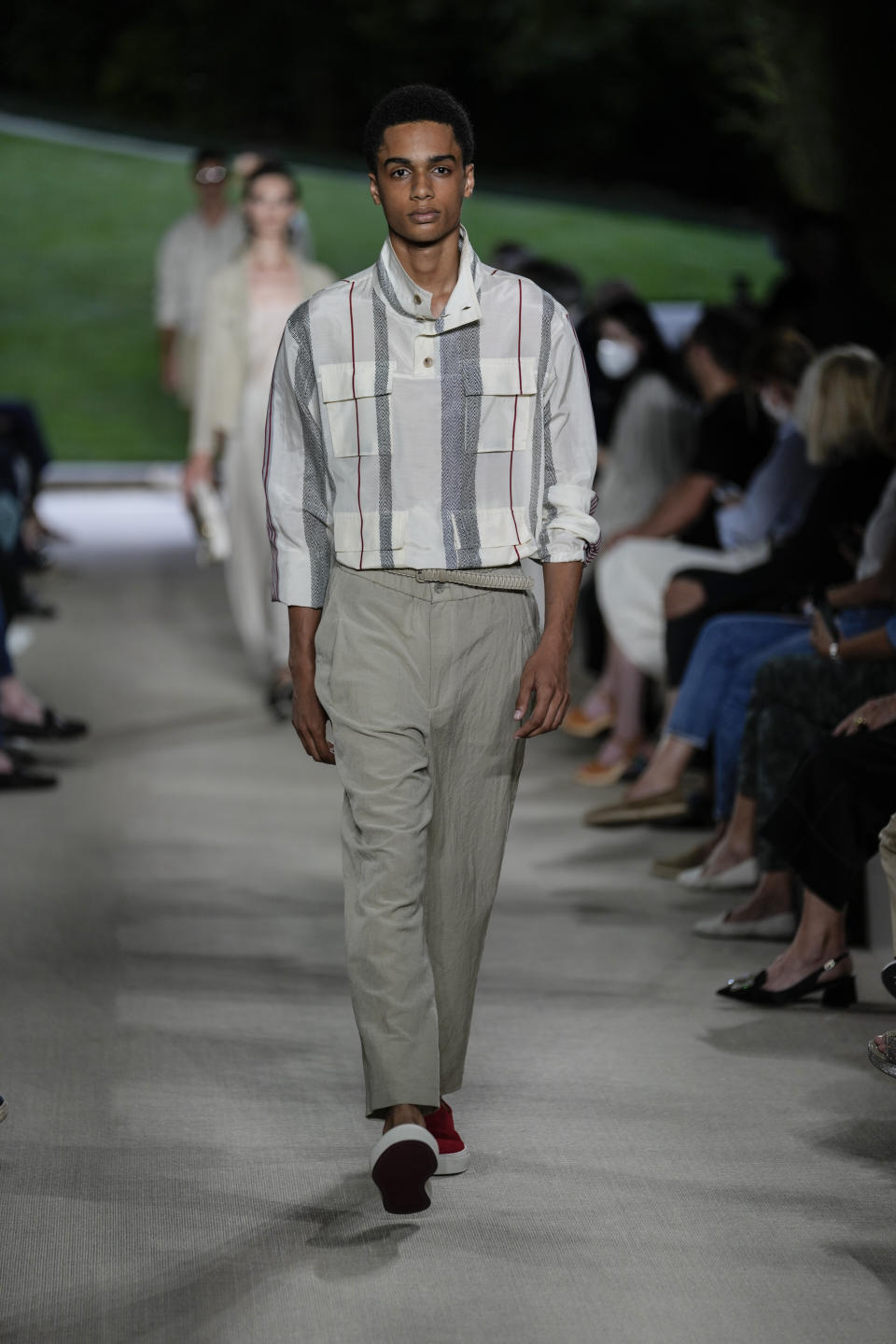 A model wears a creation as part of the Giorgio Armani men's Spring Summer 2022 collection, in Milan, Italy, Monday, June 21, 2021. (AP Photo/Luca Bruno)