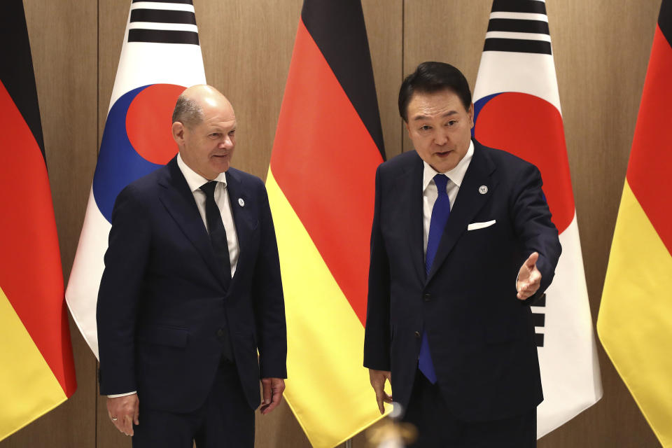 German Chancellor Olaf Scholz, left, and South Korea's President Yoon Suk Yeol arrive for their meeting at the Presidential Office in Seoul, South Korea Sunday, May 21, 2023. Scholz arrived in Seoul on Sunday for the summit with Yoon after attending the G7 summit in Hiroshima, Japan. (Chung Sung-Jun/Pool Photo via AP)