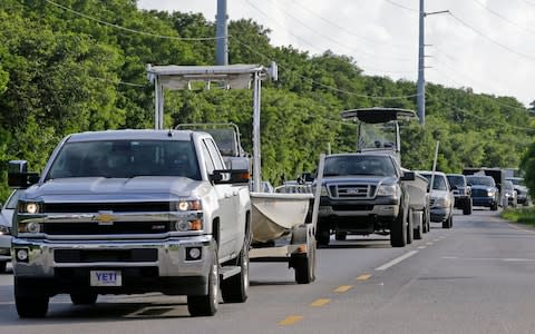 Motorists head north on US Route 1 as Hurricane Irma moves its path in the northeast Caribbean - Credit: Alan Diaz/AP