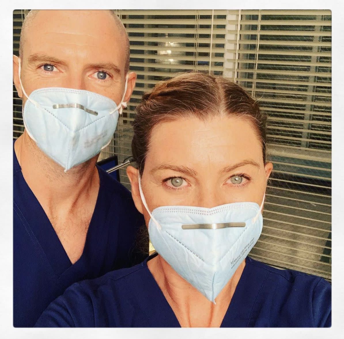 Ellen Pompeo and co-star Richard Floor, Meredith Grey's potential new love interest, snap a selfie on set during the first day back since shutting down months ago. "First time back in my scrubs... since we shut down filming 7000 healthcare workers have died from Covid. I dedicate my season 17 to all who have fallen and to everyone of you who by the grace of God is still standing... this season is for you with humility and a bit of humor to get us through and endless amounts of gratitude. I hope we do you proud."