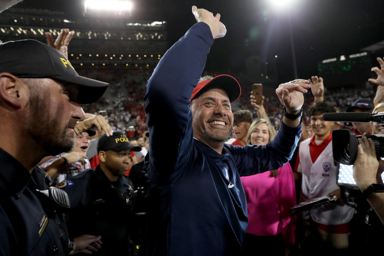 Arizona coach Jedd Fisch celebrates with fans after the Wildcats defeated Oregon State on Oct. 28. (Christopher Hook/Icon Sportswire via Getty Images)