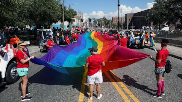 PHOTO: FILE - A group holds a rainbow flag while celebrating the start of the Tampa Pride Parade in the Ybor City neighborhood of Tampa, Fla., March 25, 2023 (Octavio Jones/Reuters, FILE)