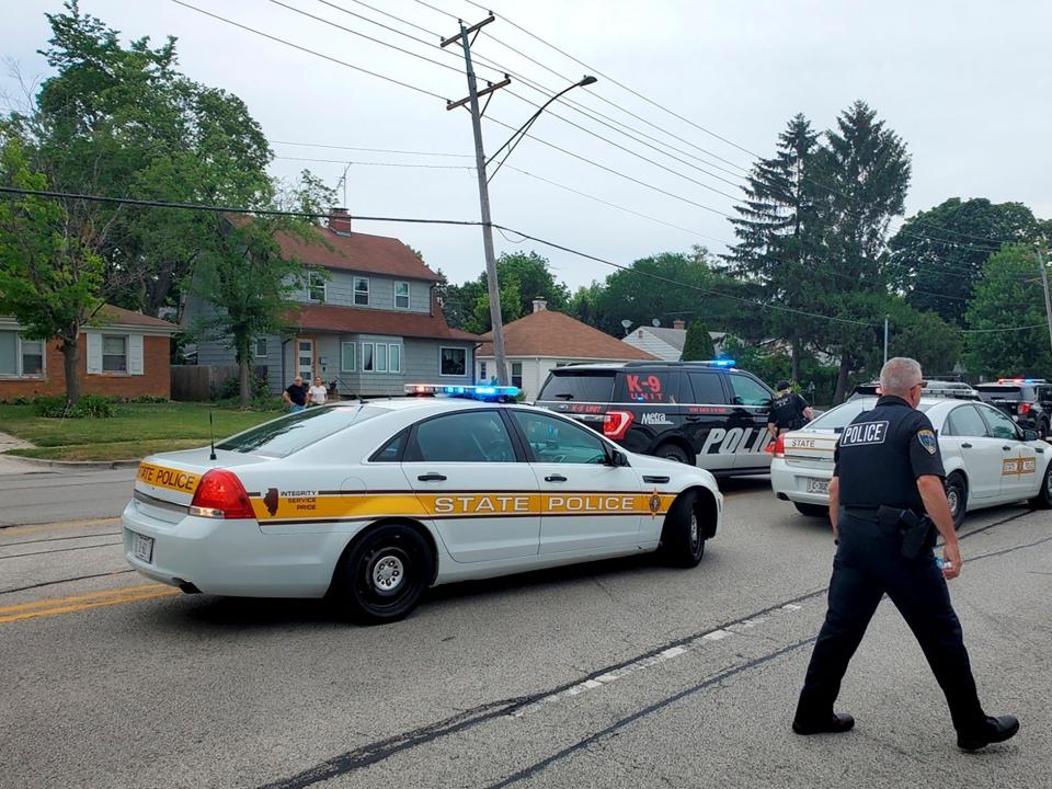 Police deploy after gunfire erupted at a Fourth of July parade route in the wealthy Chicago suburb of Highland Park, Illinois, U.S. July 4, 2022