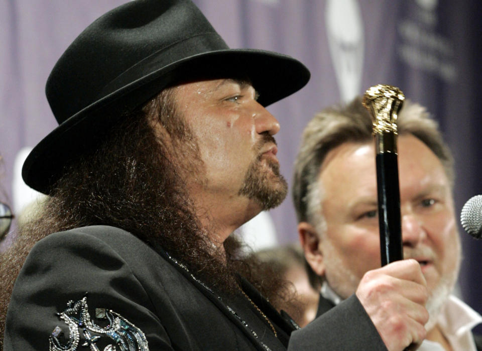 FILE - Gary Rossington from the band Lynyrd Skynyrd answers questions as Ed King looks on, backstage after being inducted at the annual Rock and Roll Hall of Fame dinner in New York, Monday, March 13, 2006. Rossington, Lynyrd Skynyrd’s last surviving original member who also helped to found the group, died Sunday, March 5, 2023, at the age of 71. (AP Photo/Stuart Ramson, File)