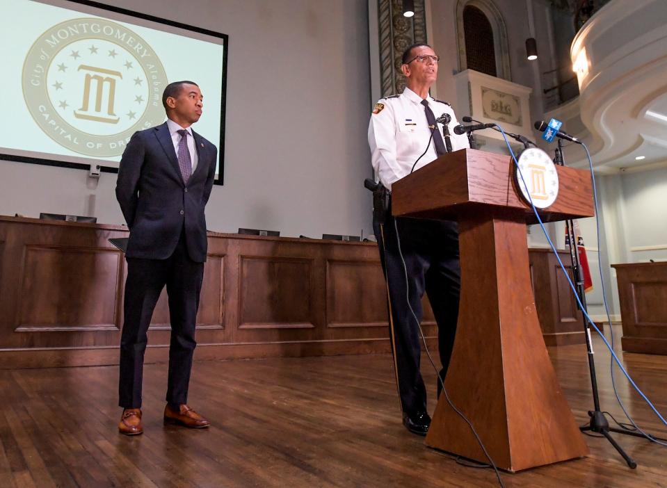 Montgomery Mayor Steven Reed, left, listens as Police Chief Darryl Albert speaks a news conference at City Hall in Montgomery, Ala., on Tuesday, Aug. 8, 2023, to discuss a riverfront brawl.