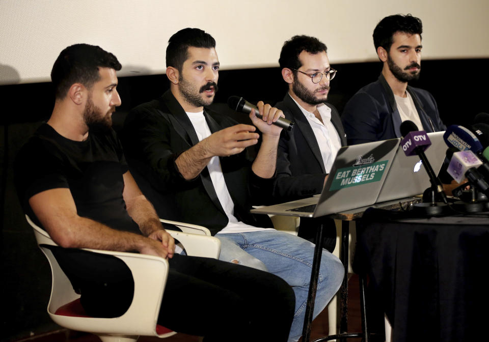 FILE - In this Thursday, April 28, 2016 file photo, Lebanese Hamed Sinno, second left, lead singer and song writer of the Lebanese group Mashrou' Leila or "Leila's Project" band, speaks during a press conference with his band musicians, in Beirut, Lebanon. A Lebanese band that supports gay rights has found itself at the center of a heated debate in Lebanon about freedom of expression. Church leaders and conservative politicians demand that a concert by Mashrou' Leila in the coastal city of Byblos be canceled, setting off a storm of indignation on social media. (AP Photo/Hussein Malla, File)