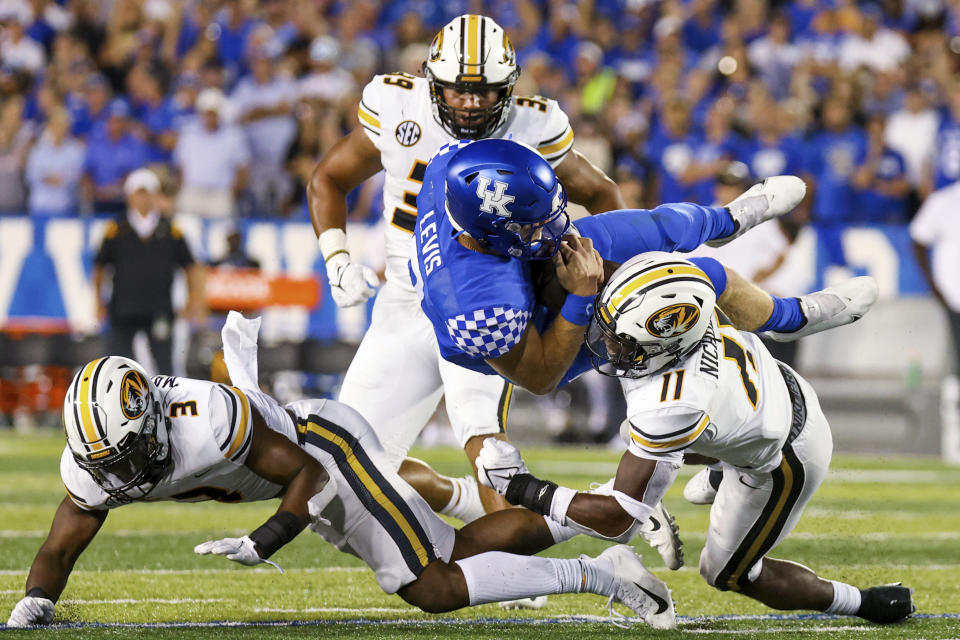 Kentucky quarterback Will Levis (7) is tackled during the second half of the team's NCAA college football game against Missouri in Lexington, Ky., Saturday, Sept. 11, 2021. (AP Photo/Michael Clubb)